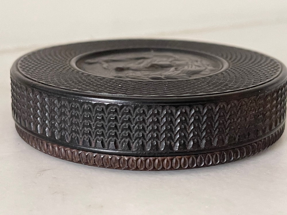 An Antique Snuff Box - Ebony Engine Turned, Haydn/ Shakespeare View VII