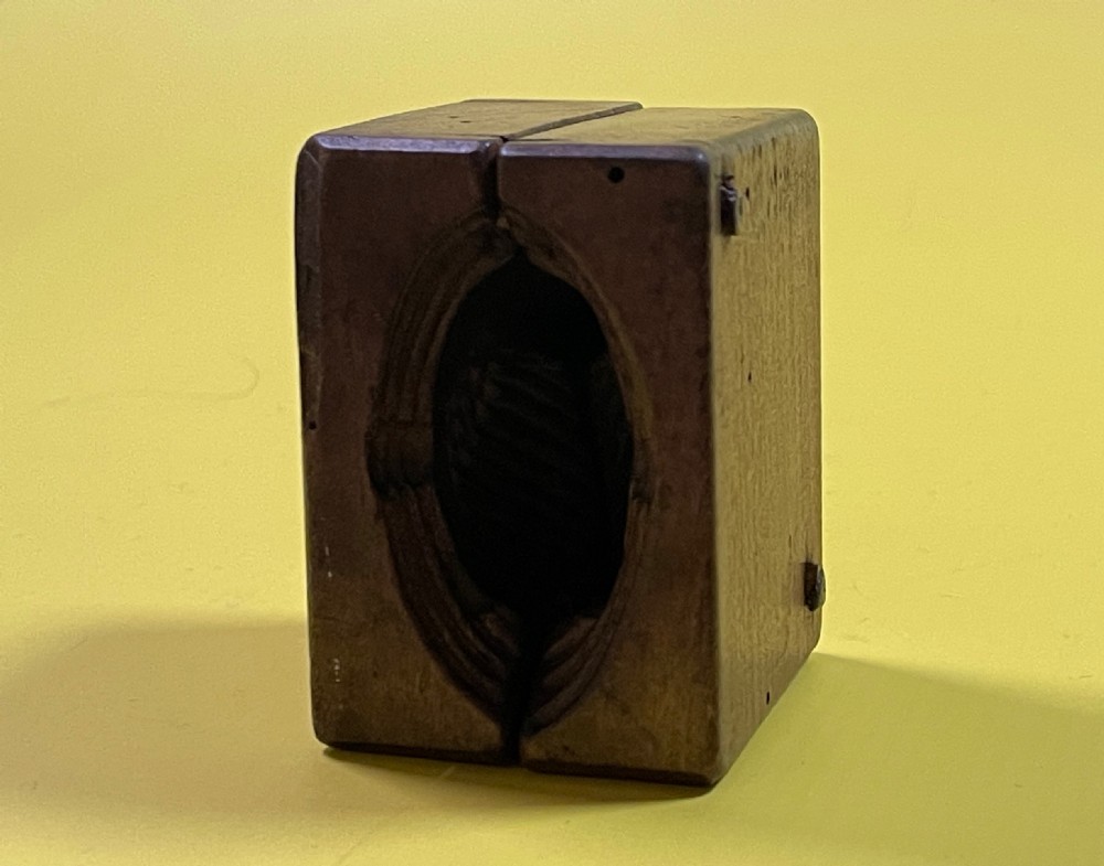 A Double Antique Treen Butter Mould View VII