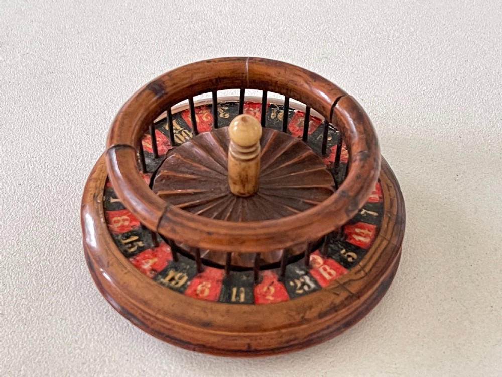 An unusual 19th century mini roulette game - ex  Charlton Collection. View VII