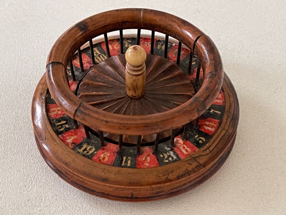An unusual 19th century mini roulette game - ex  Charlton Collection. View VIII