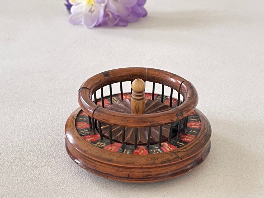 An unusual 19th century mini roulette game - ex  Charlton Collection. View IX