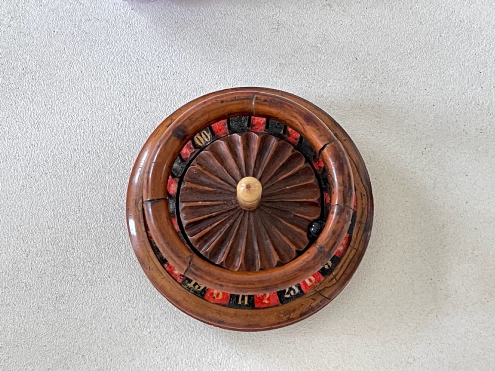 An unusual 19th century mini roulette game - ex  Charlton Collection. View XI