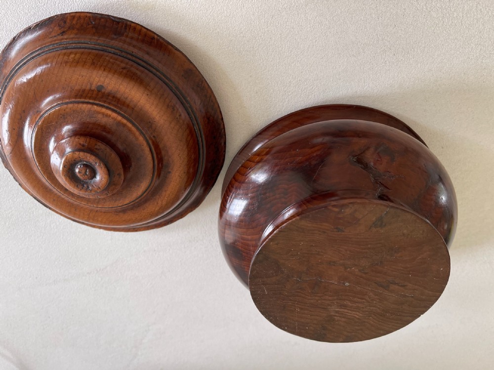 A turned yew wood spice pot featuring a stepped lidded top and a circular pedestal base. View IV