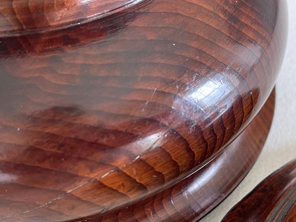 A turned yew wood spice pot featuring a stepped lidded top and a circular pedestal base. View VI