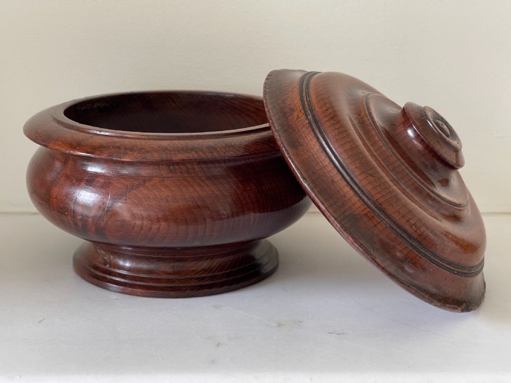 A turned yew wood spice pot featuring a stepped lidded top and a circular pedestal base. View VII