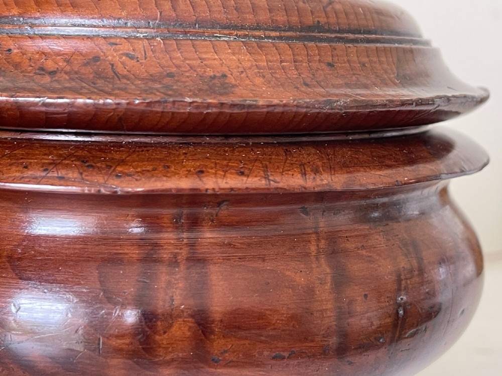 A turned yew wood spice pot featuring a stepped lidded top and a circular pedestal base. View VIII