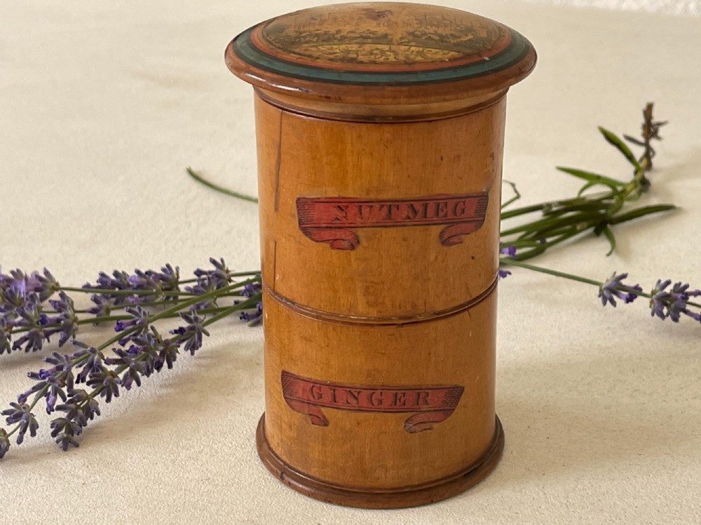 A rare small antique treen spice tower and nutmeg grater.