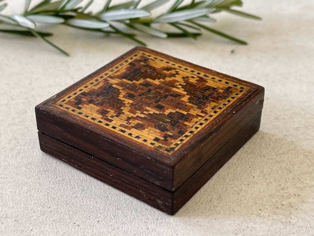 An Antique Treen Tunbridge Ware Puzzle, unusually still retaining its original instructions. View II