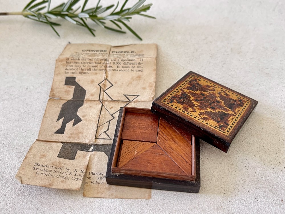 An Antique Treen Tunbridge Ware Puzzle, unusually still retaining its original instructions. View III