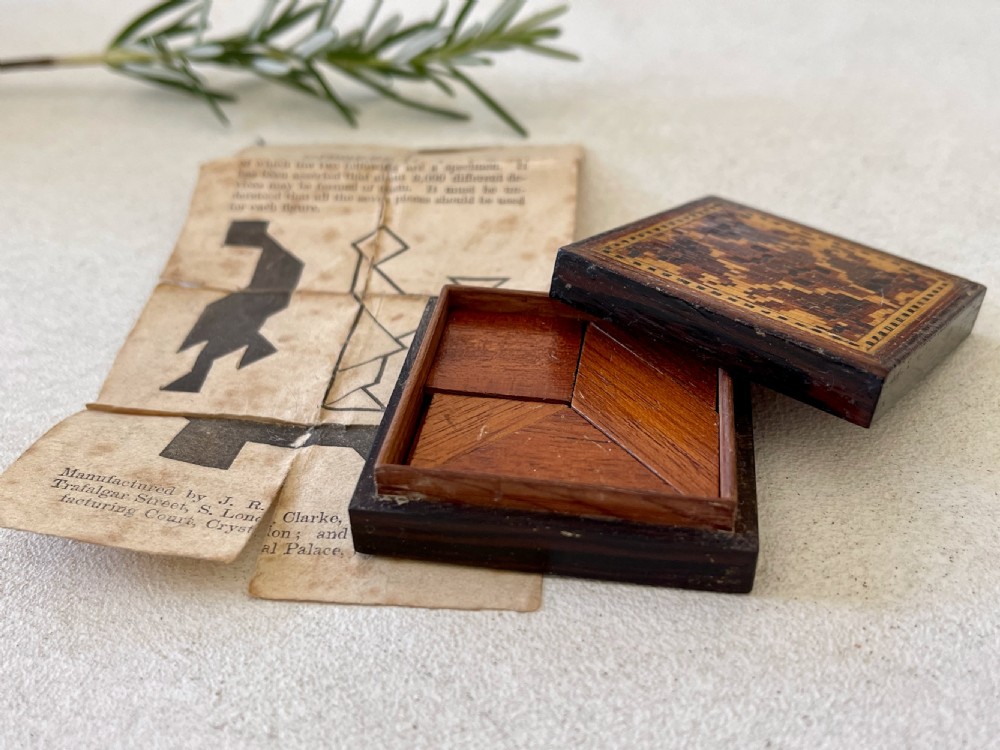 An Antique Treen Tunbridge Ware Puzzle, unusually still retaining its original instructions. View VI
