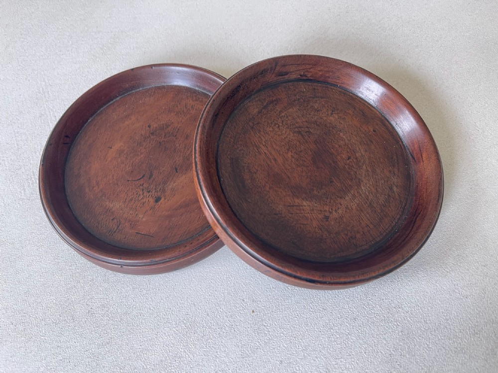 A Pair of Antique Mahogany Wine Coasters View II