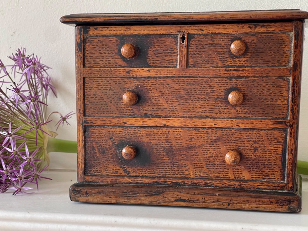 An Antique Oak Box - in the form of a mini chest of drawers