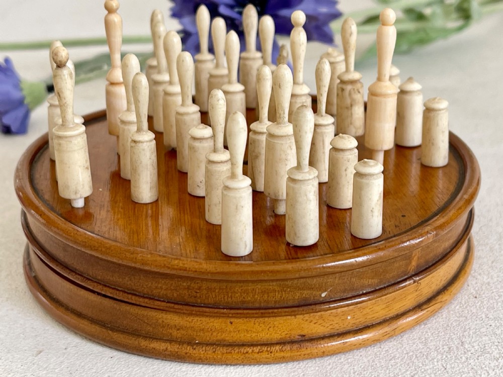 An Antique Treen Travelling Solitaire Game- complete with all its bone pegs View VI