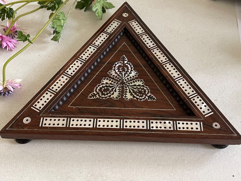 An Antique Triangular Cribbage Board