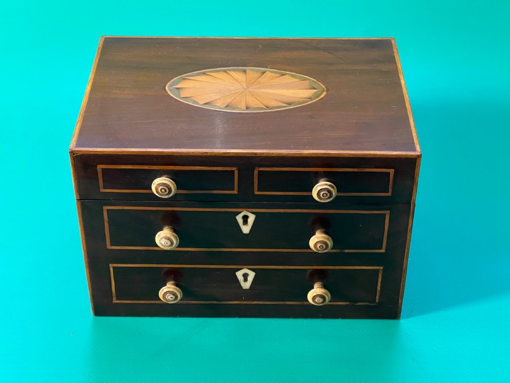 An Antique Tea Caddy in the shape of a Chest of Drawers