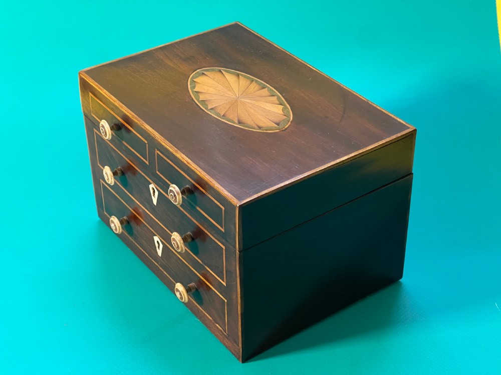 An Antique Tea Caddy in the shape of a Chest of Drawers View III