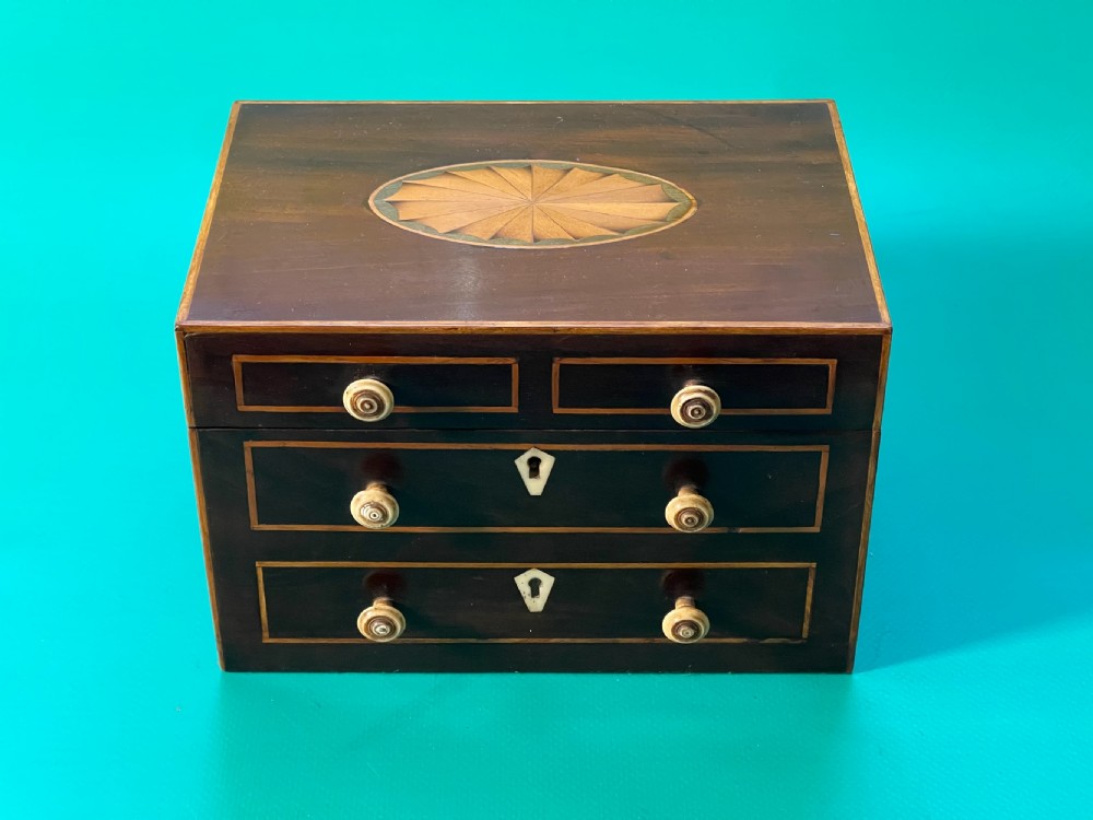 An Antique Tea Caddy in the shape of a Chest of Drawers View VIII