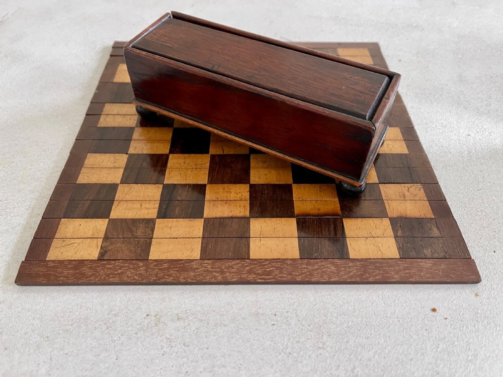 A Small Roll Up Chess Board & Boxed Chess Pieces View II