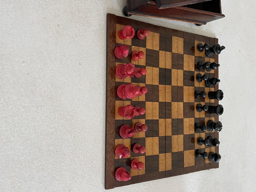 A Small Roll Up Chess Board & Boxed Chess Pieces View III