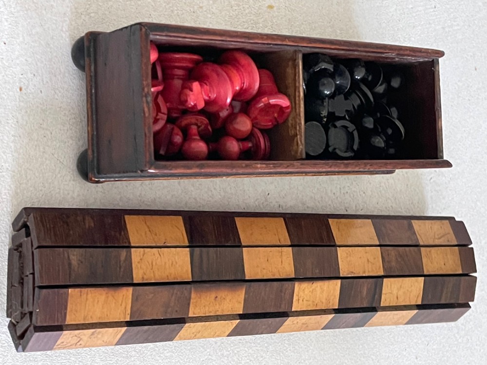 A Small Roll Up Chess Board & Boxed Chess Pieces View V