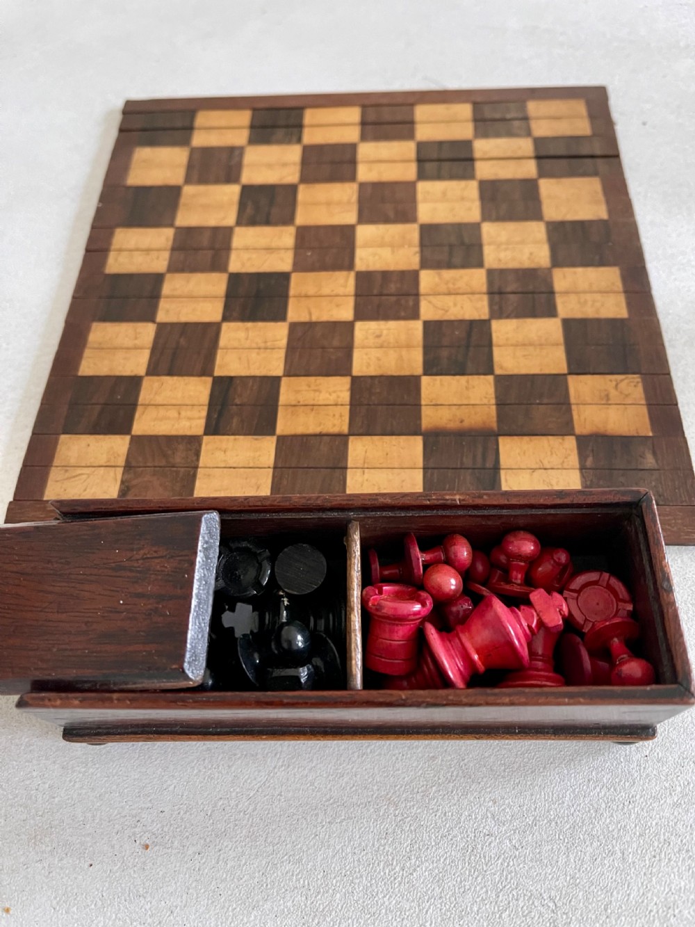 A Small Roll Up Chess Board & Boxed Chess Pieces View VI