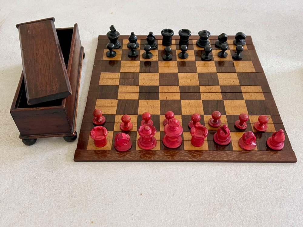 A Small Roll Up Chess Board & Boxed Chess Pieces View VII