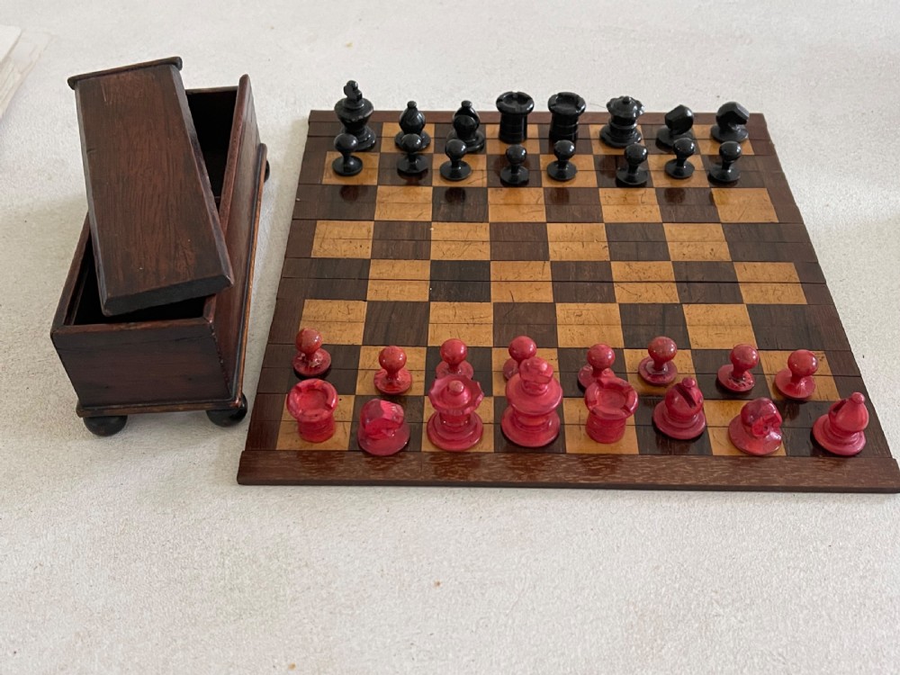 A Small Roll Up Chess Board & Boxed Chess Pieces View VIII