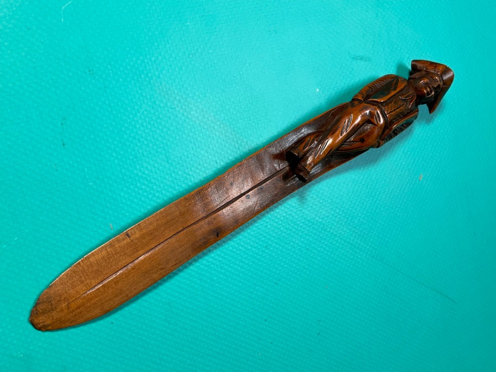 An Antique Treen Figural Page Turner