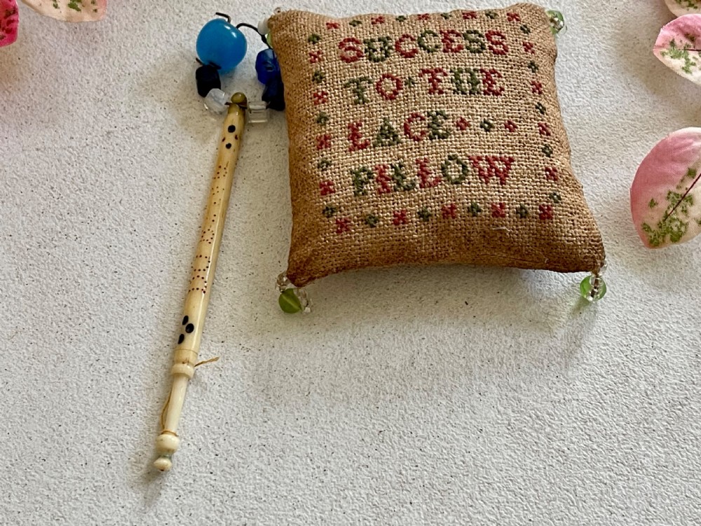 An Antique Lace Pillow and Bobbin - George Dubling