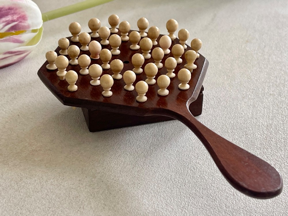 A Mini Sized Peg Solitaire Board & Bone  Pegs View III