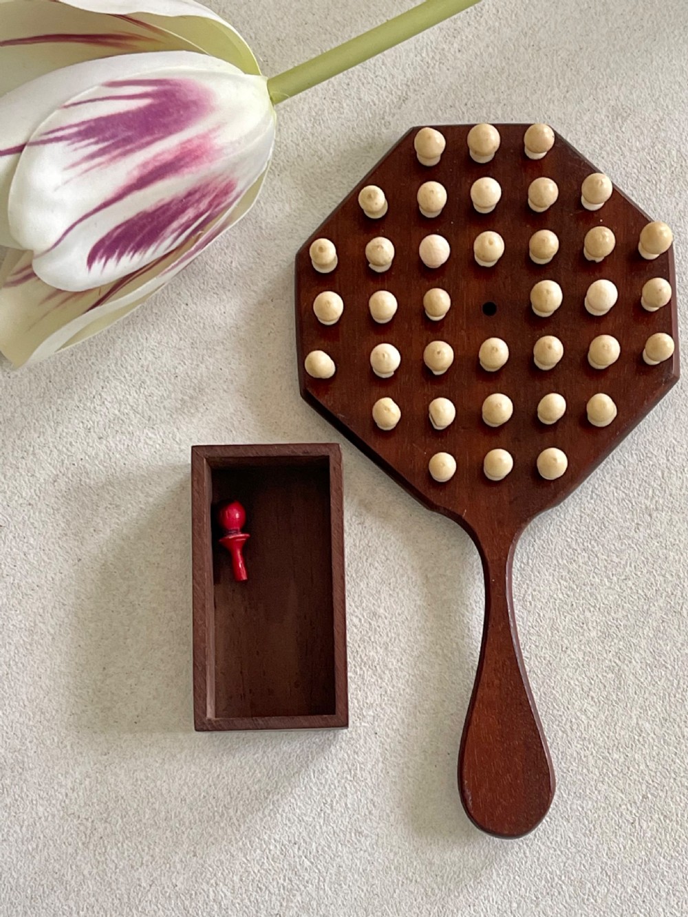 A Mini Sized Peg Solitaire Board & Bone  Pegs View V