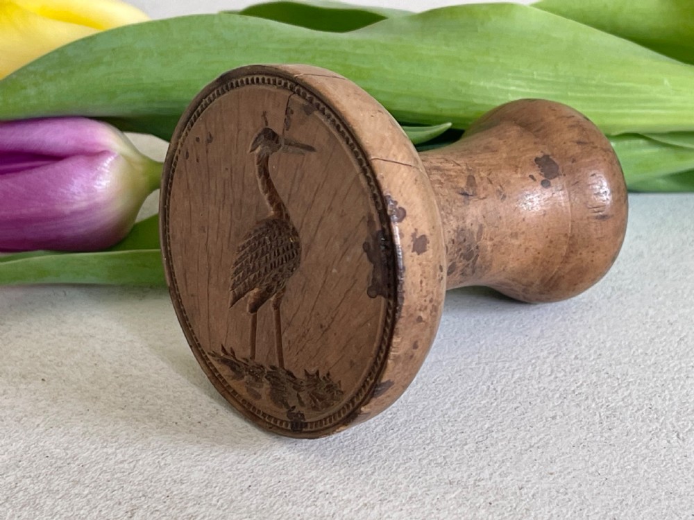 An Antique Treen Butter Stamp - Heron/Crane - maker/retailers stamp View VI
