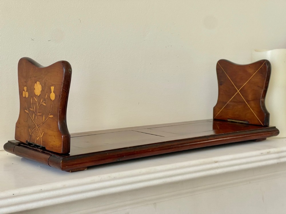 An antique Victorian Irish Killarney arbutus wood book slide featuring inlaid floral marquetry and folding hinged ends. View III