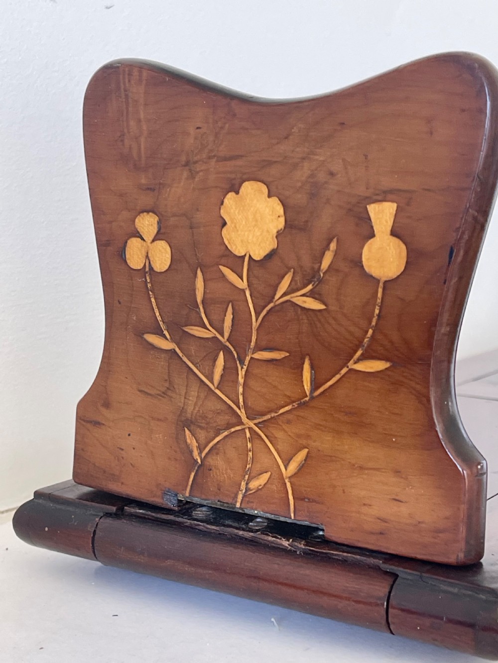 An antique Victorian Irish Killarney arbutus wood book slide featuring inlaid floral marquetry and folding hinged ends. View VIII