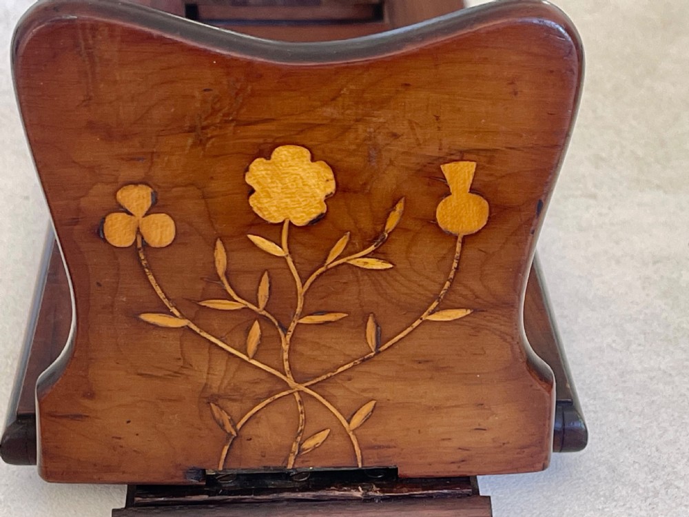 An antique Victorian Irish Killarney arbutus wood book slide featuring inlaid floral marquetry and folding hinged ends. View XI