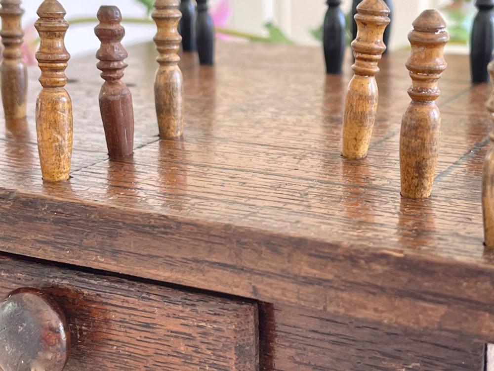 An Antique Nine Men's Morris Game - complete with pegs, drawer for storage View V