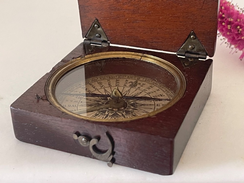 An antique Georgian square mahogany box compass shown open, featuring a brass bezel, glass top, and brass hook clasp. View II