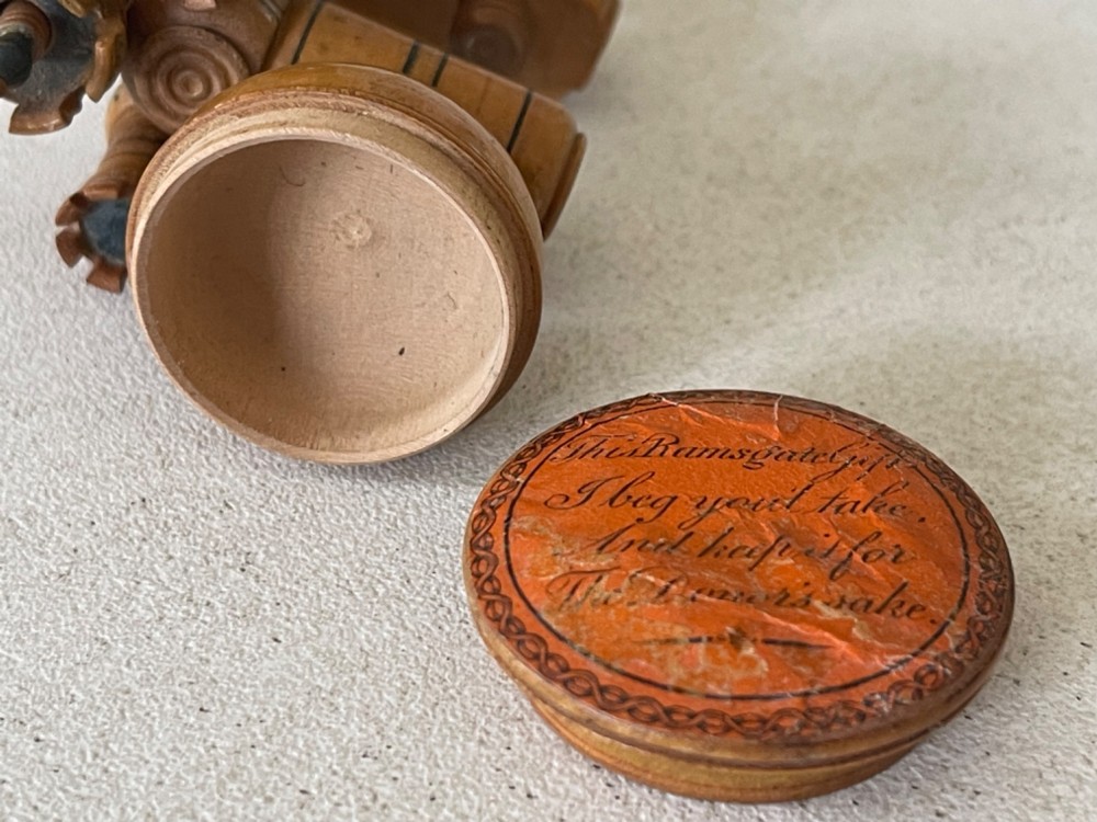 A Georgian turned wood sewing clamp featuring an upper pincushion cup, threaded wooden clamp mechanism, painted line decoration, and matching wooden needle cases. View II