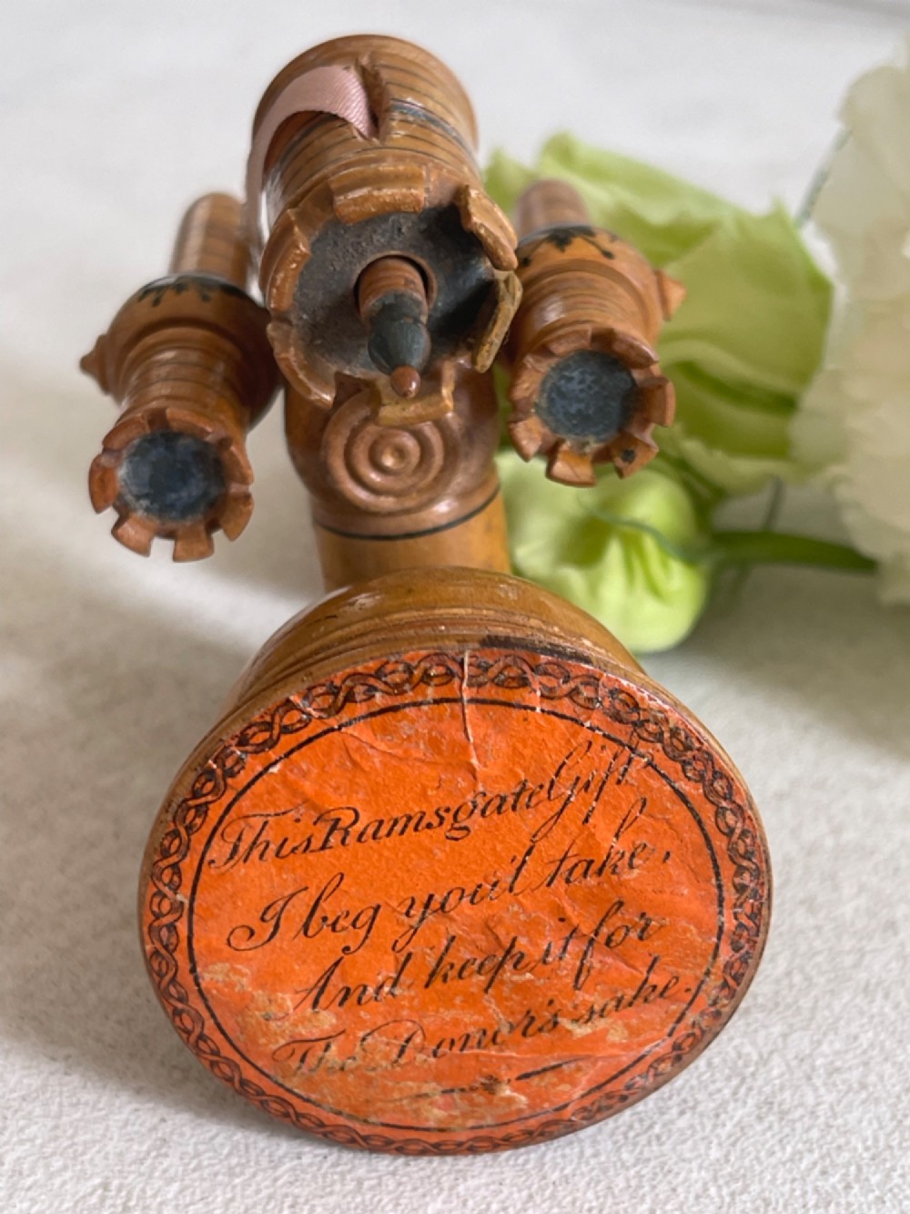 A Georgian turned wood sewing clamp featuring an upper pincushion cup, threaded wooden clamp mechanism, painted line decoration, and matching wooden needle cases. View VII