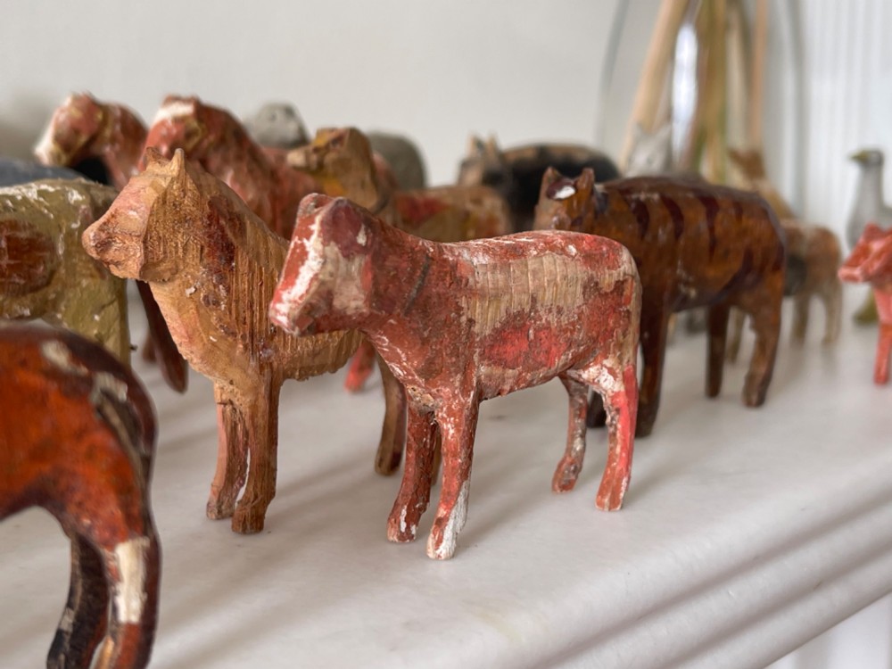 A hand-painted 19th-century wooden Noahs ark toy with a pitched roof and painted windows, accompanied by carved wooden figures. View IX