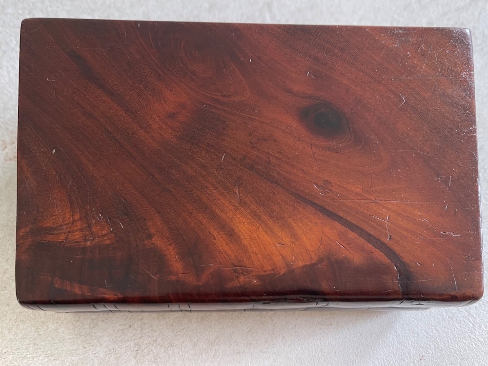 An antique dark polished wood box carved in the shape of two vertical book spines. View III