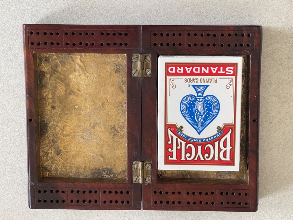 An antique dark polished wood box carved in the shape of two vertical book spines. View V