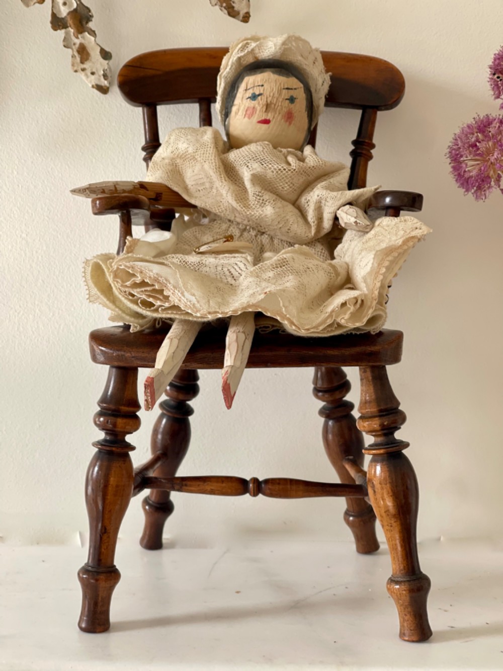 A miniature dark wood Windsor armchair featuring a shaped top rail, turned spindle back, sculpted armrests, and turned legs linked by stretchers. View VI
