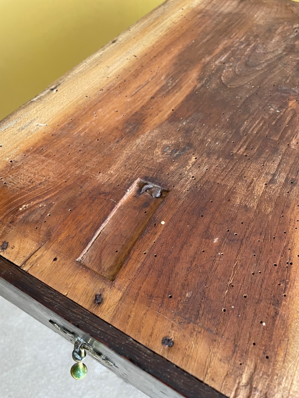 A 17th-century dark oak rent table featuring two frieze drawers with decorative brass handles, supported on turned legs with a rectangular perimeter stretcher. View XIII