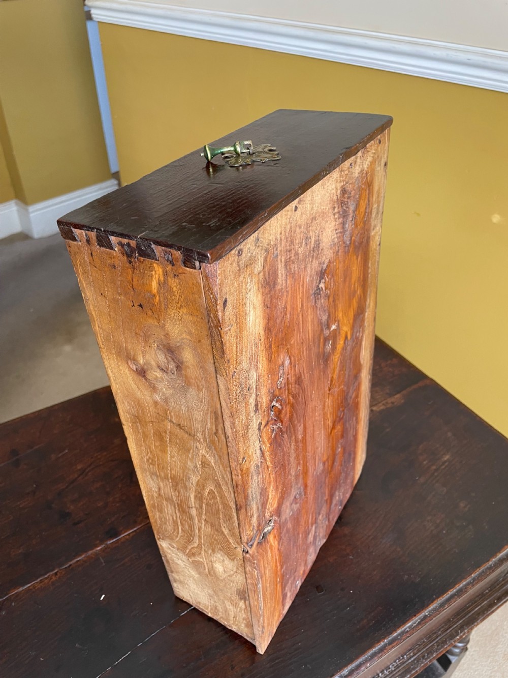 A 17th-century dark oak rent table featuring two frieze drawers with decorative brass handles, supported on turned legs with a rectangular perimeter stretcher. View XVI