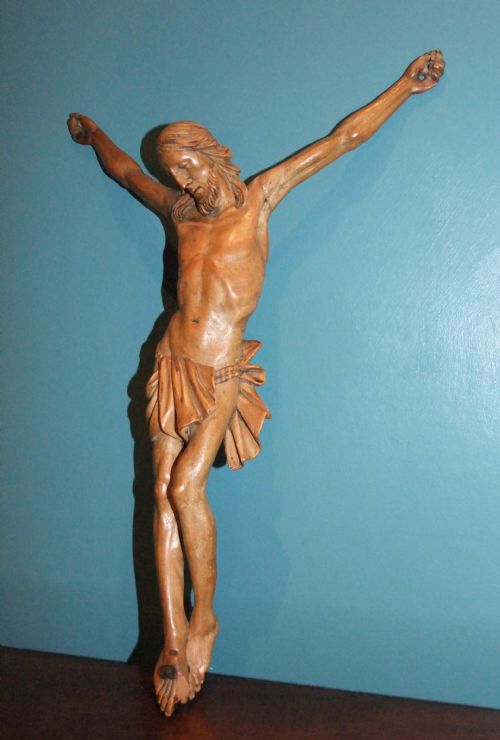 fig 2. An 18th-century carved fruitwood figure of Corpus Christi showing anatomical detail and draped loincloth against a plain background.