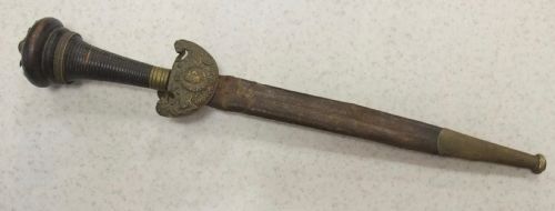 fig 1. An antique French Napoleonic naval dagger with a tapered steel blade, ornate brass guard, turned dark grip, and leather scabbard.