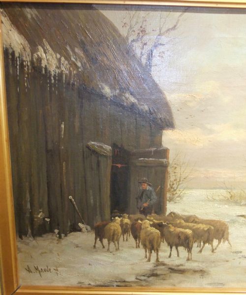 fig 1. A framed 19th-century oil painting depicting a shepherd leading a flock of sheep into a barn during a snowy winter landscape, housed in a gold gilt frame.