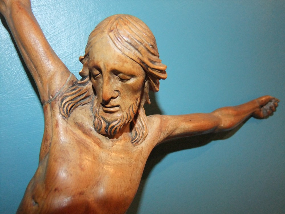 An 18th-century carved fruitwood figure of Corpus Christi showing anatomical detail and draped loincloth against a plain background. View V