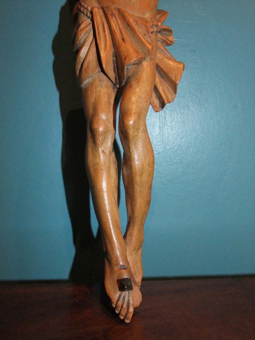 An 18th-century carved fruitwood figure of Corpus Christi showing anatomical detail and draped loincloth against a plain background. View VIII